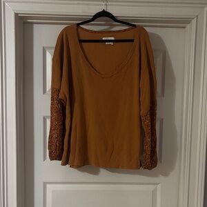 yellow anthropologie top with patterned sleeves